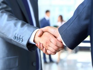 Two businessman shaking hands